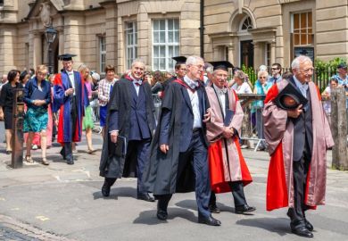Official proctors and Academics process along Catte street to All Souls College of Oxford University at graduation day.