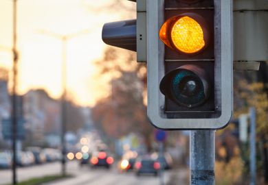 Closeup of traffic lights showing orange color Closeup of traffic lights showing orange color