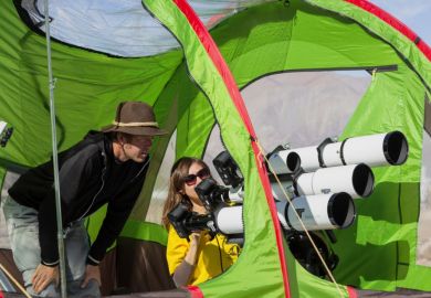 Camera arrays with special filters aim at the sun to capture the total solar eclipse.
