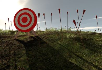 An archery target surrounded by arrows stuck in the ground An archery target surrounded by arrows stuck in the ground