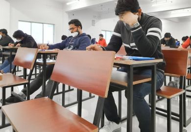 Medical students writing examination paper in mask maintaining social distancing at Radheshwam Medical College,Lucknow, UP, India. Medical students writing examination paper in mask maintaining social distancing at Radheshwam Medical College,Lucknow, UP, India.