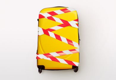 A yellow suitcase bound up with tape