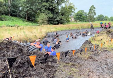Participants in a 'Tough Mudder' event