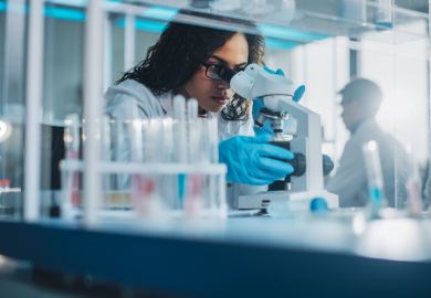 Biotechnology specialist working with advanced equipment Biotechnology specialist working with advanced equipment