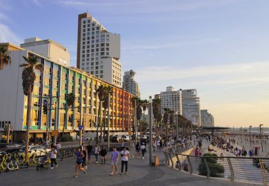 Dan Tel Aviv hotel and Tel Aviv promenade in the evening Dan Tel Aviv hotel and Tel Aviv promenade in the evening