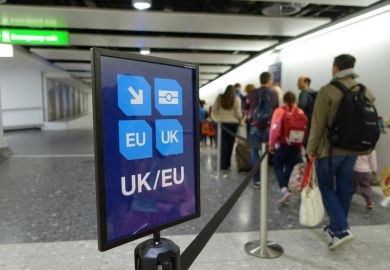 A UK/EU arrivals sign at an airport