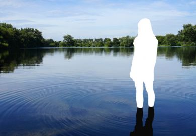 A whited out silhouette of a person stands in a lake