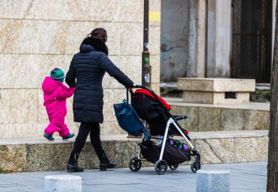 mother with child in front of a laptop computer