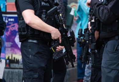 Horizontal shot of armed police patrolling