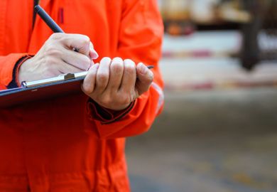 Close-up of some hands holding a clipboard and writing something Close-up of some hands holding a clipboard and writing something