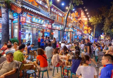 Crowds gather at Guijie Street, Beijing