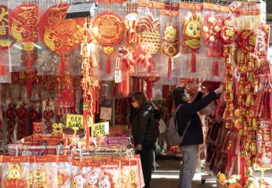 To celebrate the coming Chinese New Year outdoor shopping stalls place red goods representing luck for sale. To celebrate the coming Chinese New Year outdoor shopping stalls place red goods representing luck for sale.