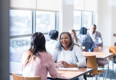 Woman helping student