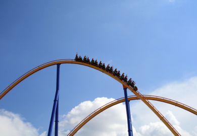 Roller coaster at the top of a rise