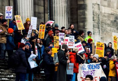 A group of students on the steps of their university in Leeds, England