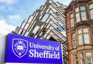 Close up of a sign for the University of Sheffield, with The Diamond building,