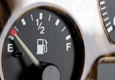 Fuel gauge on car dashboard - almost empty