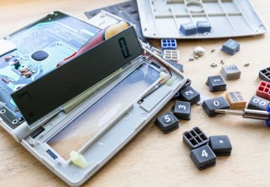 A dismantled calculator A dismantled calculator
