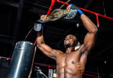 A boxer holds aloft his Lonsdale belt