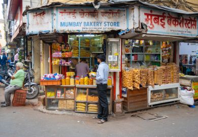 Indian man at bakery in the street.