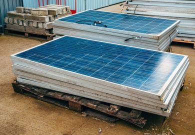 Old obsolete solar panels in factory yard