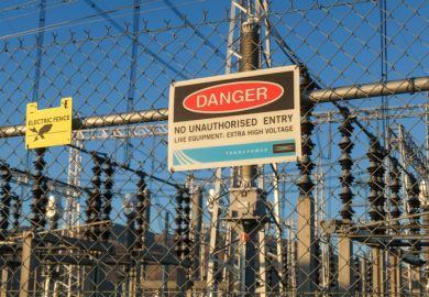 Danger sign on fence of an electricity substation