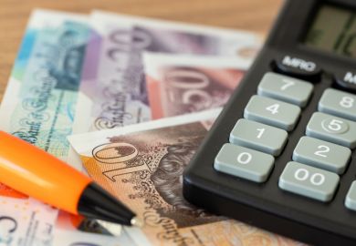 Pile of money and cacluator