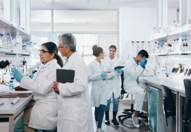 Scientists in a laboratory researching for a clinical trial 