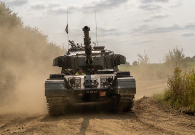 Close up of an army tank on a military training session.