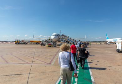 Lufthansa jet ready for boarding with passengers embarking the aircraft at Valencia.