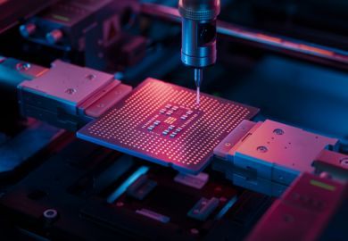 A microchip illuminated with right light during production 