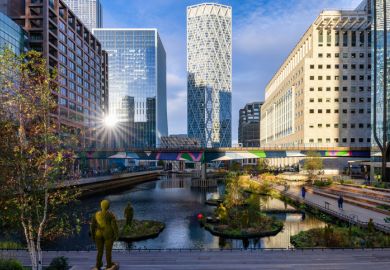 Morning sunrise view of the inner Dock of Canary Wharf in London