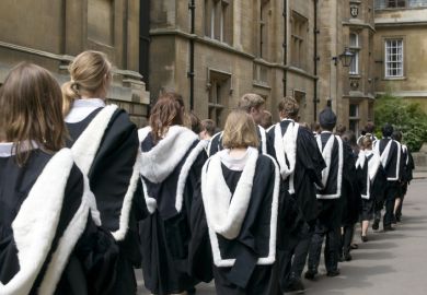 Cambridge University students from Clare College dressed in their graduation gowns on graduation day