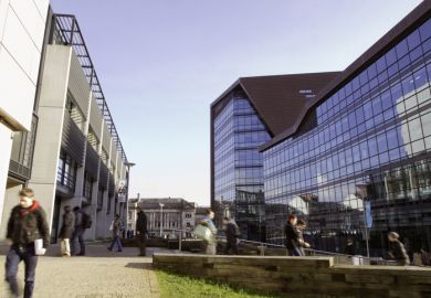 Students can be seen walking to and from the Roland Levinsky building at the University Of Plymouth in the city centre of Plymouth.