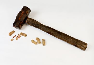 Hammer and cracked nut