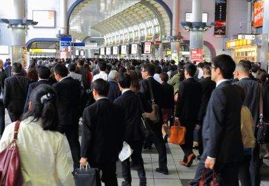 Commuters on the metro in Tokyo, Japan Commuters on the metro in Tokyo, Japan
