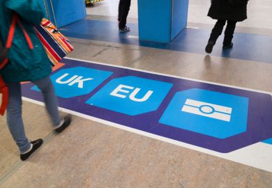 December 2, 2016: Passport control signage on the floor at Gatwick Airport directs passengers to 'non EU', 'UK' and 'EU' passport control points. 