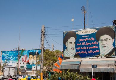 photograph of the Ayatollah Khomeini at the entrance gate of the Mausoleum of Saadi.
