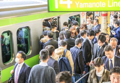 Crowd of commuters ascends and drops from train at rush hour in Shinjuku Station Crowd of commuters ascends and drops from train at rush hour in Shinjuku Station