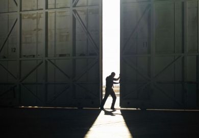 Man pushing door open