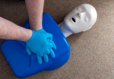 Doctors perform CPR on a manikin