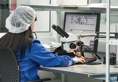 control operator checks the finished circuit board