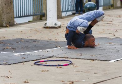 uncomfortable position contortion street performer