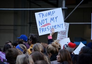 A "Trump: Not my president" sign