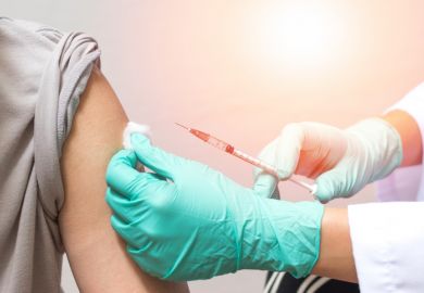 Woman being vaccinated vaccine needle inoculation injection