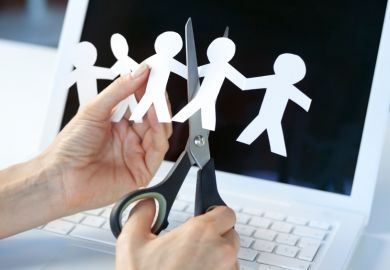 Someone cuts some human figures out of paper