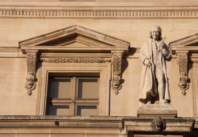 Statue of Voltaire on the Louvre palace