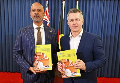Race discrimination commissioner Giridharan Sivaraman (left) and education minister Jason Clare (right) are seen during a press conference to release the Racism@Uni report at the Commonwealth Parliamentary Offices (CPO) in Brisbane, 17 February 2026.