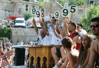 Judges scoring bridge jumping contest, Mostar, Bosnia