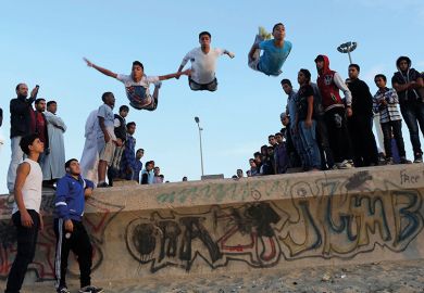  Young Libyans practise parkour on the beach in Benghazi